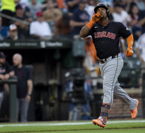 Image of Jose Ramirez hitting a home run and celebrating.